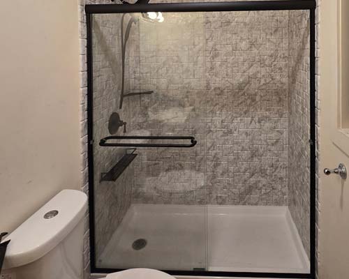 White siding house on a grassy hill