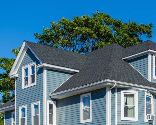 Storm damaged shingle with circled damage marks